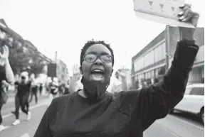  ?? ARIEL COBBERT/THE COMMERCIAL APPEAL ?? Kayla Bennett leads protesters on a march in Memphis on Wednesday during the eighth straight day of protests.