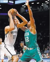  ?? KATHY WILLENS/ ?? Celtics center Al Horford, right, squares up Brooklyn Nets center Brook Lopez during a preseason game Thursday at New York. Boston signed Horford to a four-year contract worth $113 million as a free agent during the offseason in a high-risk move for a...