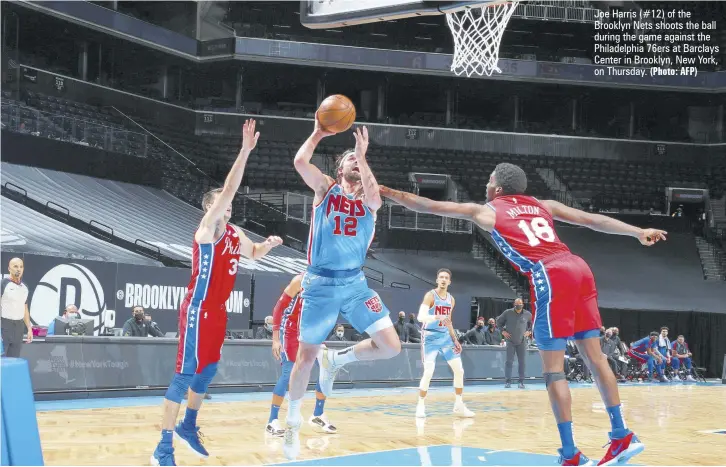  ?? (Photo: AFP) ?? Joe Harris (#12) of the Brooklyn Nets shoots the ball during the game against the Philadelph­ia 76ers at Barclays Center in Brooklyn, New York, on Thursday.