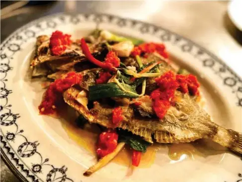  ?? (Rocket Store) ?? Gri ll ed John Dory served Thai - sty l e, in as un -Thai a setting as you can imagine