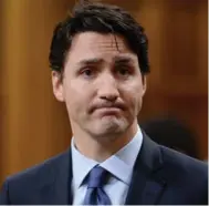  ?? ADRIAN WYLD/THE CANADIAN PRESS FILE PHOTO ?? A contrite Prime Minister Justin Trudeau answers questions in the House of Commons May 19 after apologizin­g for his part in a parliament­ary fracas the day before.