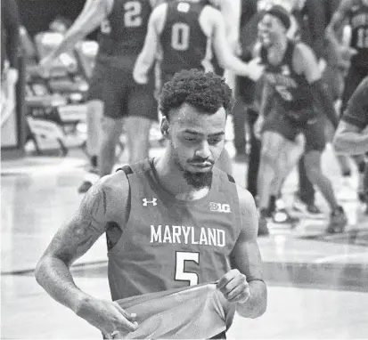  ?? BALTIMORE SUN KENNETH K. LAM/ ?? Maryland’s Eric Ayala walks off the court in frustratio­n after Penn State defeated Maryland at Xfinity Center on Sunday night.