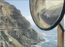  ?? PICTURE: MICHAEL WALKER ?? LOOKING SHARP: A cyclist reflected in a traffic mirror trains on Chapmans Peak in preparatio­n for the Cape Town Cycle Tour tomorrow.