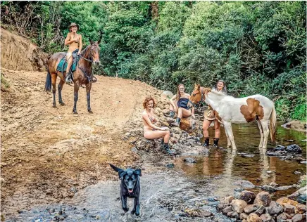  ??  ?? Sporting the bare essentials are Demi Barr, left, Ritchie Tomson, Joelle Pritchard and Ella Kiely.