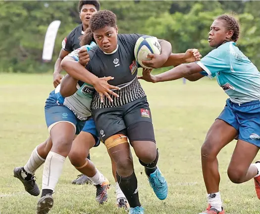  ?? Photo: Bua Rugby ?? Ba women’s rugby No.8 Sera Tuwai takes on the Serua players during the Royal Tea Ranadi Cup clash.