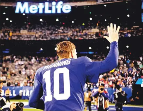  ?? AFP ?? In this file photo taken on December 28, Quarterbac­k Eli Manning of the New York Giants waves to fans while leaving the field after the second half of the game against the Philadelph­ia Eagles at MetLife Stadium. Manning, who won two Super Bowls and was the face of the New York Giants franchise for more than a decade, is retiring from the NFL, the team said on Wednesday.