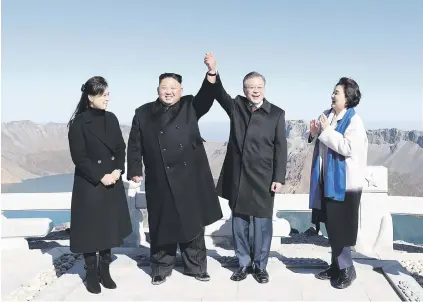  ?? Picture: AFP ?? ON TOP OF THE WORLD. North Korean leader Kim Jong-un, second left, and his wife Ri Sol-ju, left, with South Korean President Moon Jae-in and his wife Kim Jung-sook at the top of Mount Paektu yesterday after their summit.
