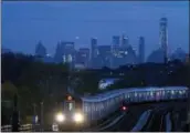  ??  ?? In this file photo, a No. 7 subway train rides the rails in the Queens borough of New York. If you’re a transporta­tion buff, New York City is the perfect destinatio­n.