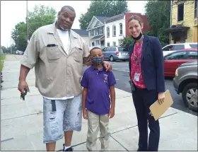  ?? PHOTO BY MELISSA SCHUMAN ?? Parent Cristopher Forte, third-grader Christian Wallace, and PS 2principal Amanda Klopott are ready for the first day of school.