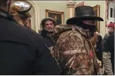  ?? MANUEL BALCE CENETA — THE ASSOCIATED PRESS FILE ?? Rioters, including Dominic Pezzola, center with beard, are confronted by U.S. Capitol Police officers outside the Senate Chamber inside the Capitol in Washington on Jan. 6.