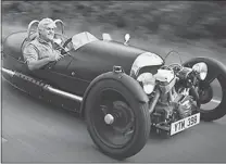  ??  ?? Jay Leno pilots a Morgan three- wheeler that, after a production run from 1910 to 1952, is now made again.