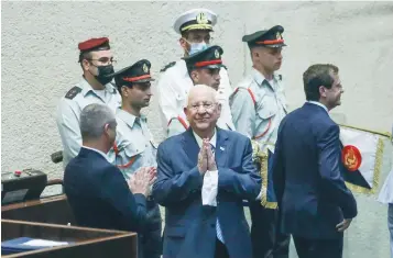 ?? (Marc Israel Sellem/The Jerusalem Post) ?? OUTGOING-PRESIDENT Reuven Rivlin makes a parting gesture during the inaugurati­on ceremony for his successor, Isaac Herzog (right).