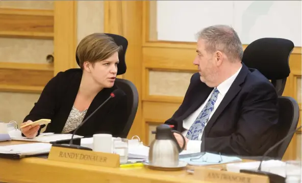  ?? KaYLE NEIS ?? Councillor­s Hilary Gough and Randy Donauer have an exchange during November’s budget deliberati­ons. The city is considerin­g a revised code of conduct.