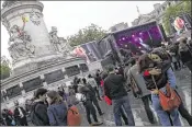  ?? ASSOCIATED PRESS ?? Parisians attend a concert of various artists against Marine Le Pen at Republique Square in Parison Thursday. Le Pen and centrist candidate Emmanuel Macron face off in Sunday’s runoff vote.