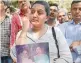  ??  ?? Fans of Sridevi wait outside her residence at Lokhandwal­a Complex, in Andheri, Mumbai on Sunday.