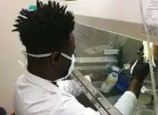  ?? University of Minnesota, via St. Paul Pioneer Press ?? Glenn E. Simmons, Jr., an assistant professor at the University of Minnesota medical school in Duluth, prepares a sample of wastewater to be tested for coronaviru­s inside the school's laboratory in May 2020.