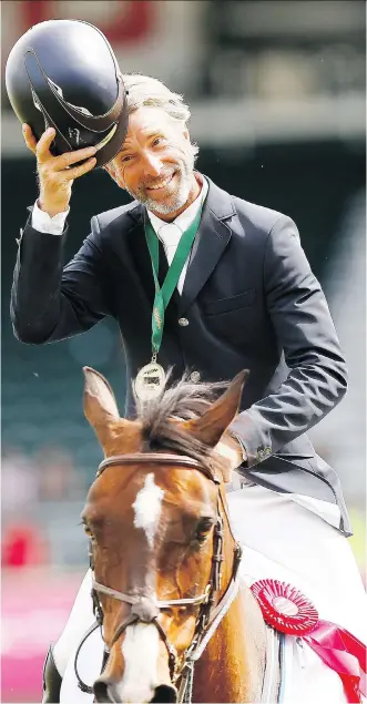  ?? DARREN MAKOWICHUK ?? Richard Spooner tips his cap after riding Cristallo to victory in the CNOOC Nexen Cup Derby at Spruce Meadows. They’re just the third horse and rider to win the Derby for three straight years.