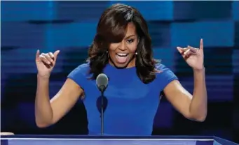  ?? AP ?? First lady Michelle Obama speaks to delegates during the first day of the Democratic National Convention in Philadelph­ia on Monday.