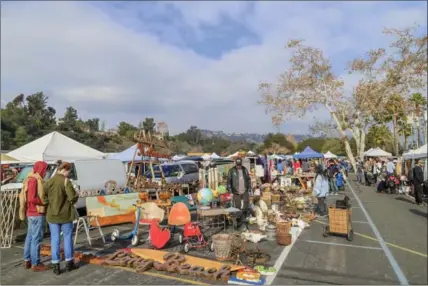  ?? DREAMSTIME, TNS ?? A flea market, like the famous one shown here at the Rose Bowl, held in Pasadena, Calif. is a good place to find deals on furniture.