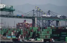  ?? AP FIle ?? MOVING MERCH: Containers are stacked at the Port of Los Angeles.