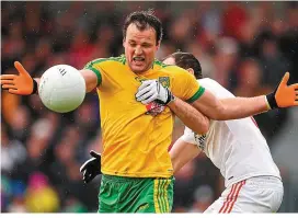  ??  ?? Michael Murphy came in for plenty of close attention from Tyrone when the sides last clashed in Ballybofey in 2015, as did Ryan McHugh – below, being tackled by Tiernan McCann and Matthew Donnelly – in the 2016 Ulster final