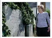  ??  ?? Sheila searches for the gravestone­s of her ancestors at St Mary’s Church, Whittlesey­e