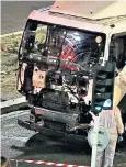  ??  ?? Forensics officers examine the lorry used to cause carnage on the Nice seafront