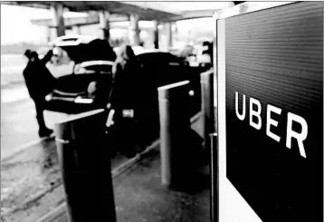  ?? SETH WENIG/AP 2017 ?? Independen­t contractor­s, such as Uber and Lyft drivers, will get a tax break under the new law.