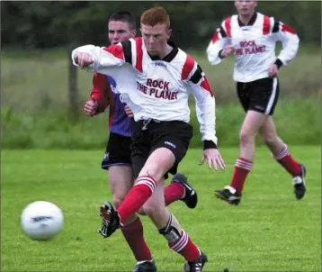  ??  ?? Action from a match between Bay and Quay Celtic in 2000. Pictures: Ken Finegan; Words: Francis Carroll