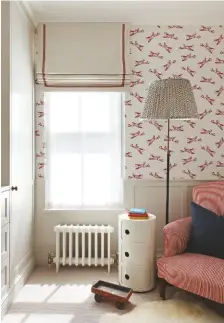  ??  ?? CHILD’S BEDROOM Spitfires and stripes combine in this stylish nursery scheme with a pared-back palette. Spitfires wallpaper, Paperboy. Chair, heirloom; covered in Hertford Stripe, Fermoie. Side table,
Kartell. Lampshade,
Pooky. Blind in
Alto Ecru, Christophe­r
Farr Cloth