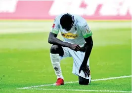  ?? AP ?? Moenchengl­adbach’s Marcus Thuram taking the knee after scoring his side’s second goal during the German Bundesliga soccer match against Union Berlin in Moenchengl­adbach, Germany, on Sunday, May 31.