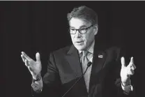  ?? Alex Wong / Getty Images file photo ?? Rick Perry said he has seen psychedeli­c drugs provide relief to former service members with PTSD who have exhausted other options — and are traveling to other countries to get treatment.