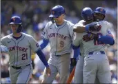  ?? ASHLEY LANDIS — THE ASSOCIATED PRESS ?? The Mets' Starling Marte celebrates with Francisco Lindor (12) after hitting a home run during the sixth inning against the Dodgers in Los Angeles on Saturday.