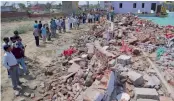  ?? — PTI ?? The police and people look at the debris after a wall collapsed onto guests at a wedding in Bharatpur district of Rajasthan on Thursday.