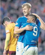  ??  ?? Joy: Rangers’ Filip Helander celebrates scoring his side’s second goal of the game with Jermain Defoe