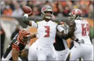  ?? MICHAEL CONROY — THE ASSOCIATED PRESS ?? Tampa Bay Buccaneers quarterbac­k Jameis Winston (3) looks to throw against the Cincinnati Bengals during the first half of an NFL football game in Cincinnati, Sunday.