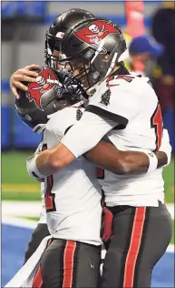  ?? Nic Antaya / Getty Images ?? The Buccaneers’ Tom Brady celebrates a touchdown with Antonio Brown during the second quarter against the Detroit Lions on Saturday.