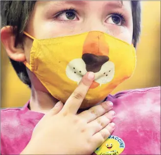  ?? Matt Freed / Associated Press ?? Oliver DeFelippis, 6, of Pittsburgh, takes a minute to calm down as he gets an early sticker before receiving a Pfizer COVID-19 vaccine at Environmen­tal Charter School.