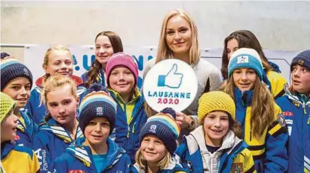  ?? EPA PIC ?? Ski racer Lindsey Vonn, Ambassador for the Lausanne 2020 Winter Youth Olympic Games , poses with kids of the skiing club Alpina, in St Moritz, Switzerlan­d on Sunday.