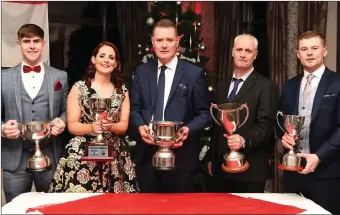  ?? Photo by Michelle Cooper Galvin ?? Under-20 Footballer of the Year Donal O’Sullivan; Club Secretary JoAnn Murphy; County Board Chairman Tim Murphy, Club Chairman John Foley and team captain Patrick O’Shea celebratin­g Kilgarvan’s victories at the Kilgarvan victory social in the Kenmare Bay Hotel, Kenmare, on Friday.