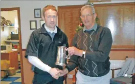  ??  ?? Hamish Taylor, right, presents Alistair McConnachi­e with the Taylor Tankard.