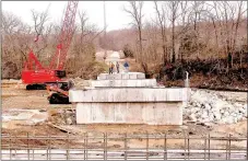  ?? RACHEL DICKERSON/MCDONALD COUNTY PRESS ?? Men work on the new Oscar Talley bridge near Lanagan.