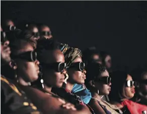  ?? GETTY IMAGES ?? Invited guests watch Black Panther in 3D.