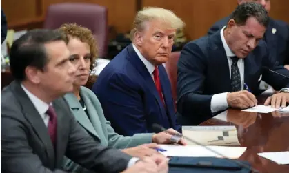  ?? ?? Donald Trump sits at the defense table with his legal team in a Manhattan court, 4 April 2023, in New York. Photograph: Seth Wenig/AP