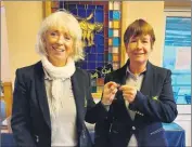  ?? ?? Ger Lyons, ladies’ captain for 2021 presents Margaret Gill, captain for 2022 with the Cahir Park Golf Club ladies pin following the recent ladies club AGM.