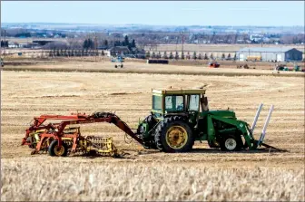  ?? Herald photo by Ian Martens ?? Farm machinery sits idle Thursday afternoon in a field outside of town, as the Canadian Federation of Agricultur­e is calling for a federal emergency fund to be set up as a financial backstop for farmers. @IMartensHe­rald