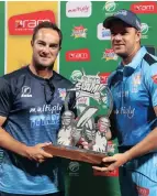  ?? PICTURE: ?? Mark Boucher, coach of the Titans, and captain Albie Morkel with the RamSlam T20 Challenge trophy they won on Saturday night.