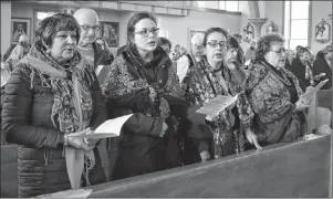  ?? JEREMY FRASER/CAPE BRETON POST ?? Parishione­rs of St. Mary’s Polish Parish in Whitney Pier are shown singing a hymn prior to the Blessing of the Easter Baskets and Easter Foods at the church on Saturday. More than 50 people attended the event.