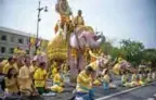  ??  ?? Elephants under the command of their mahouts bow with well-wishers during a procession near the Grand Palace to pay their respects to Thailand’s King Maha Vajiralong­korn in Bangkok yesterday. — AFP