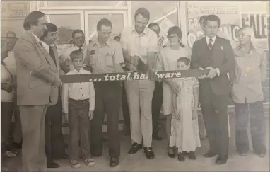  ?? Photo submitted ?? Fagan’s Crossroads held their grand opening in 1977. Homer Bynum cut the board, and Lloyd and Barbara are shown on either side of him, with their children, Mike and Kelly.